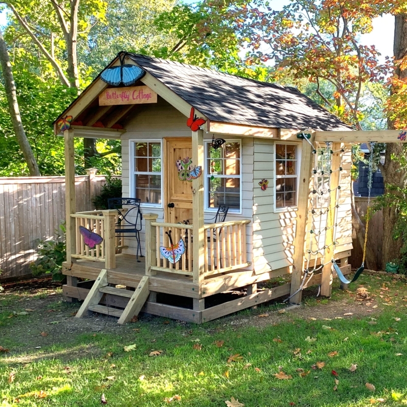 Elevated Cottage Playhouse with Climbing Net & Butterfly Sign