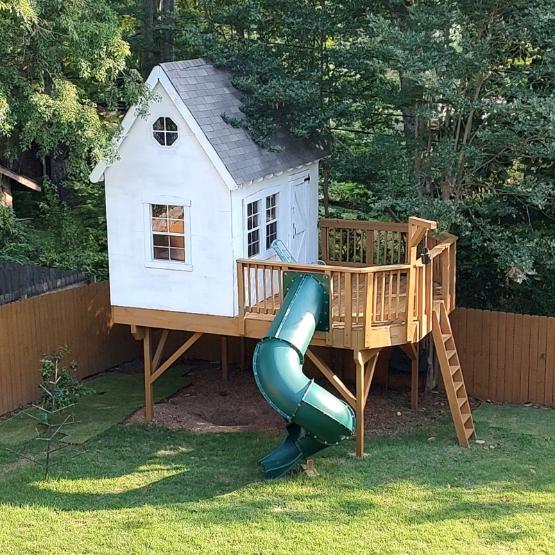 Elevated Playhouse on Stilts with Spiral Slide & Octagonal Window