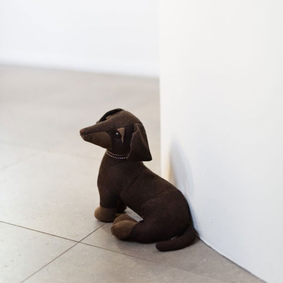Fabric Door Stop in Espresso Brown, Sitting Posture