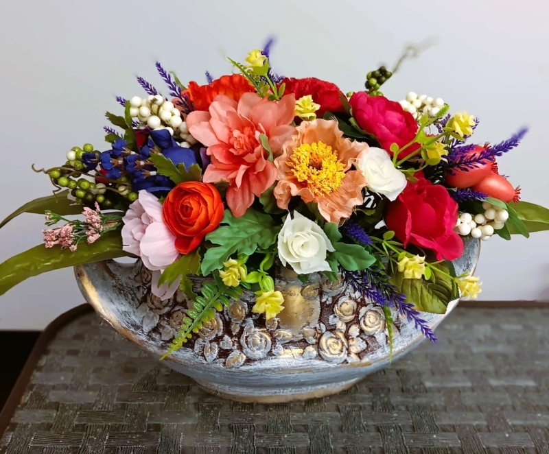 Faux Blooms Arrangement: Vibrant Mixed Flowers in Distressed Boat Vessel
