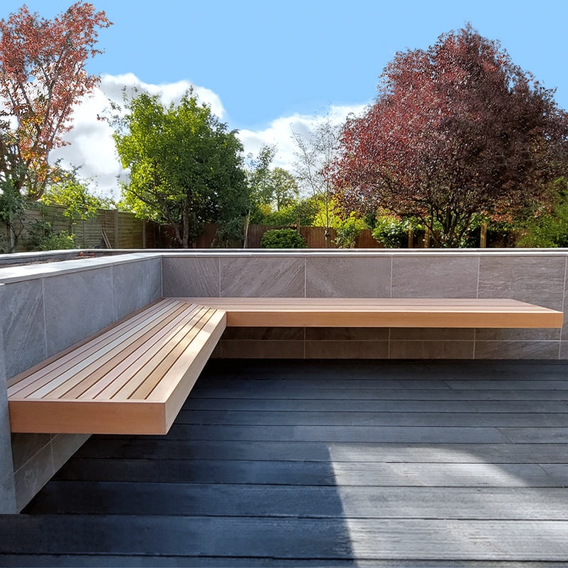 Floating Corner Bench with Cantilevered Mount and Slatted Seat