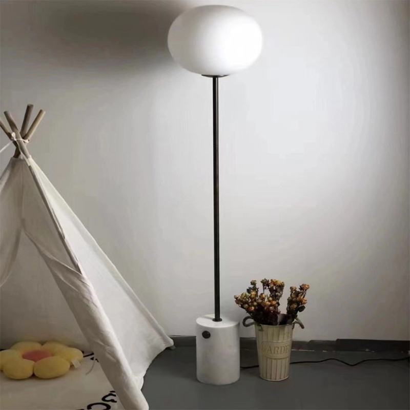 Floor Lamp with Cylindrical Marble Base and Slender Black Pole Globe