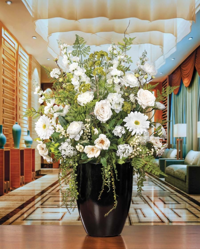 Floral Arrangement: Cascading White Roses in Glossy Tapered Black Vase
