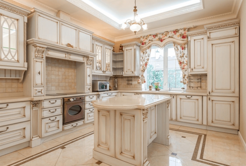 French Provincial Distressed Ivory Cabinets with Ornate Carved Corbels