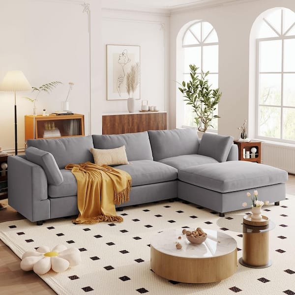 Gray L-Shaped Sectional with Sloped Arms and Oversized Ottoman