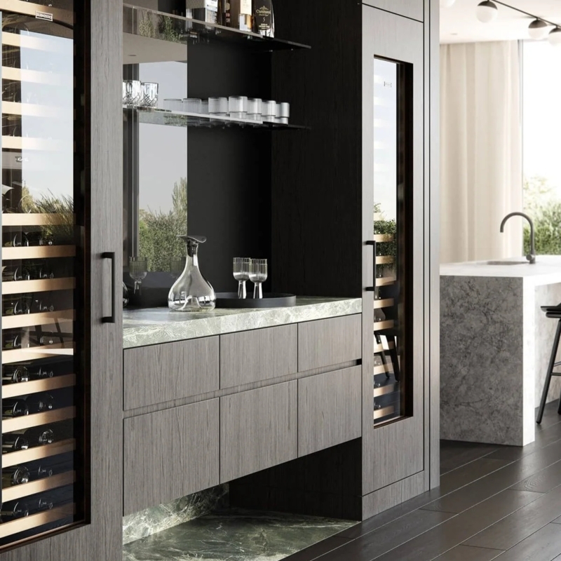 Home Bar with Green Stone Countertop & Integrated Wine Towers