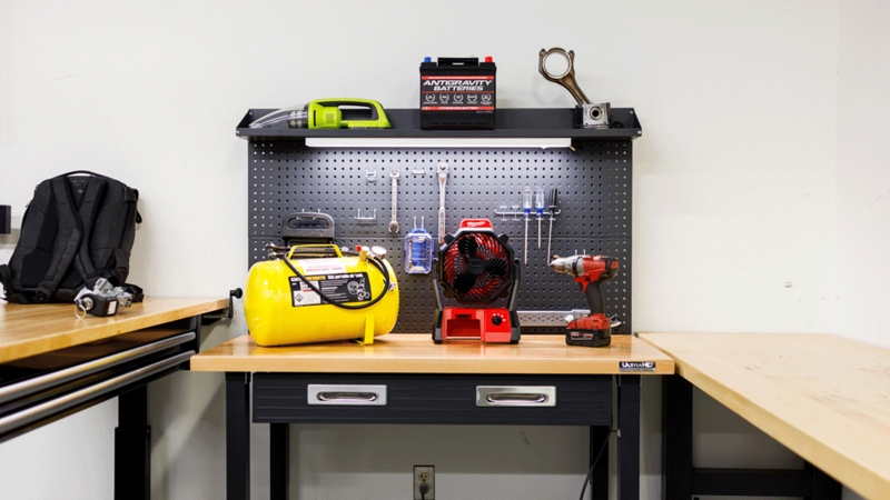 Industrial Garage Workbench with Integrated Lighting and Pegboard