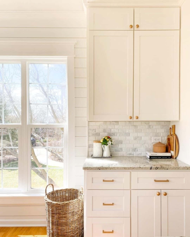 Ivory Shaker Cabinets with Gold Hardware and Stacked Uppers
