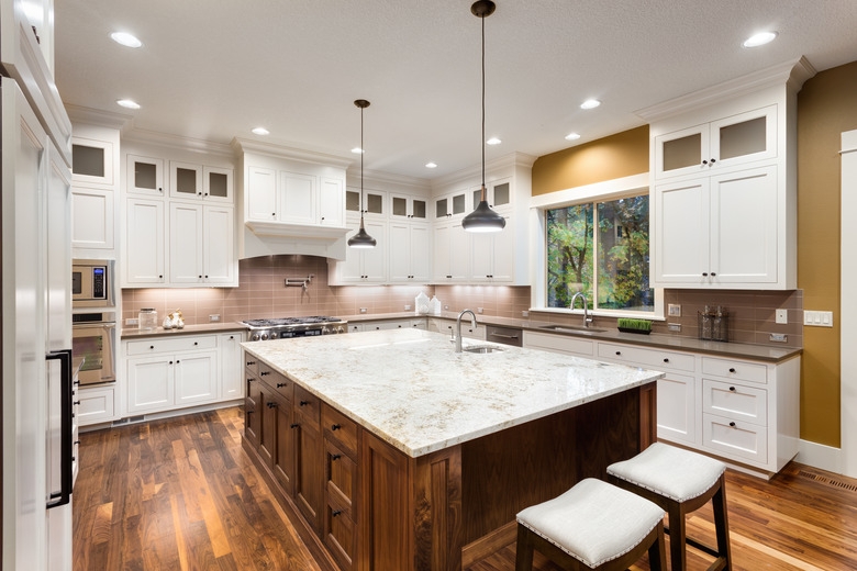 Kitchen Island with Granite Slab Top and Backless Bar Stool Seating