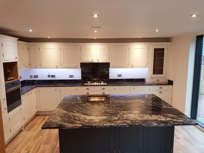 Kitchen Island with Heavy Veining and Under Cabinet Task Lighting