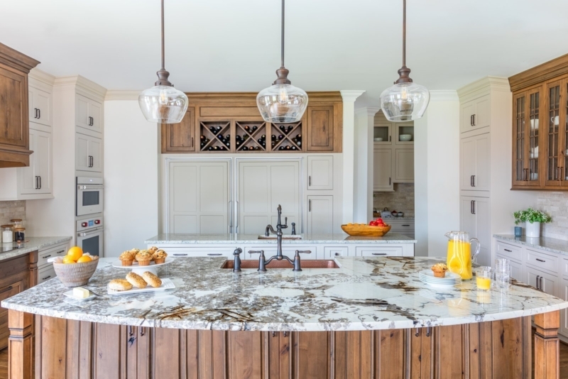 Kitchen Island with High Contrast Veining and Integrated Wine Rack