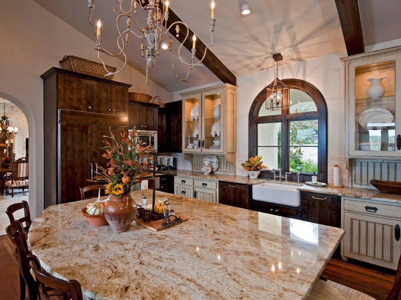 Kitchen Island with Mixed Cabinetry and Granite Countertop