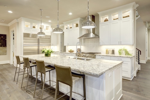 Kitchen Island with Speckled Granite Top and Industrial Chrome Pendants