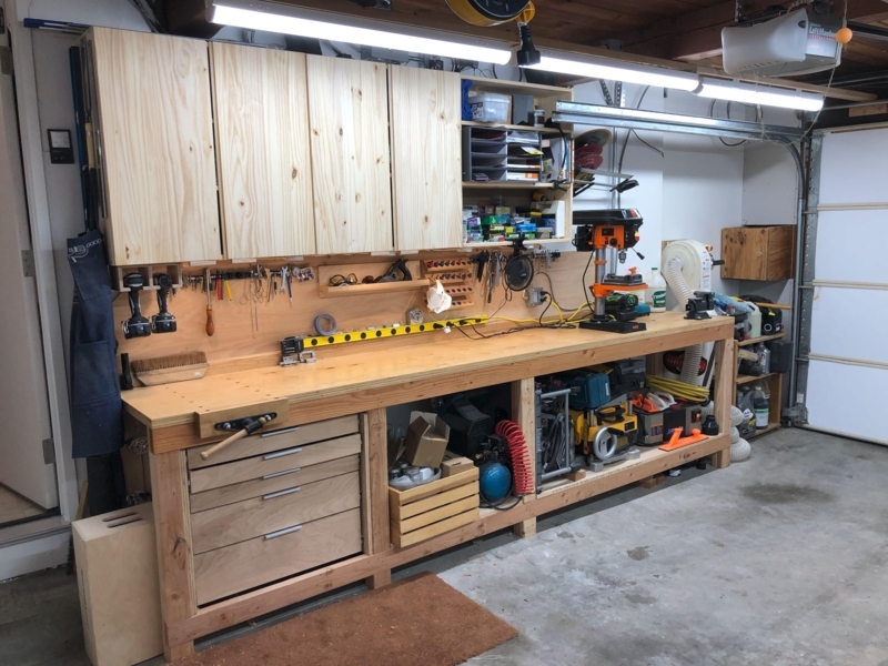 Larch Wood Workbench featuring Integrated Vise and Cabinets