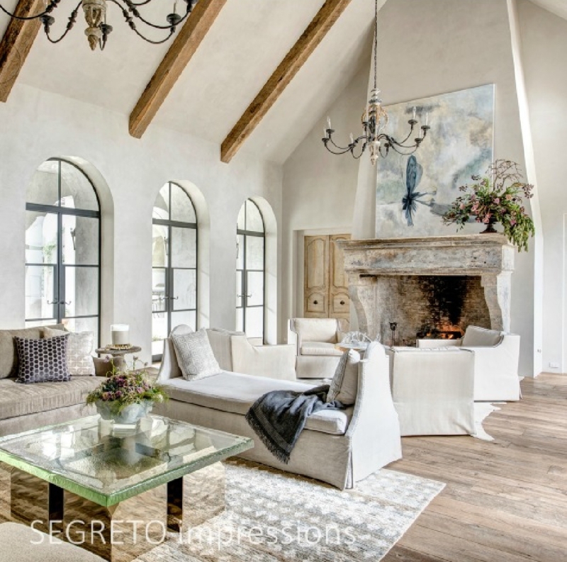 Living Room Set: Arched Steel Windows and Plaster Wall Finish