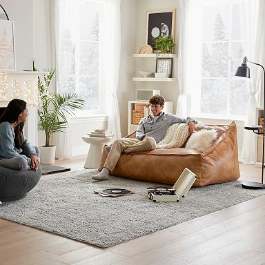 Lounger Sofa Cognac Tan Leather-Like Oversized Silhouette Sloped Back