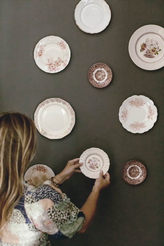 Mismatched Decorative Plates on Charcoal Background with Scalloped Rims