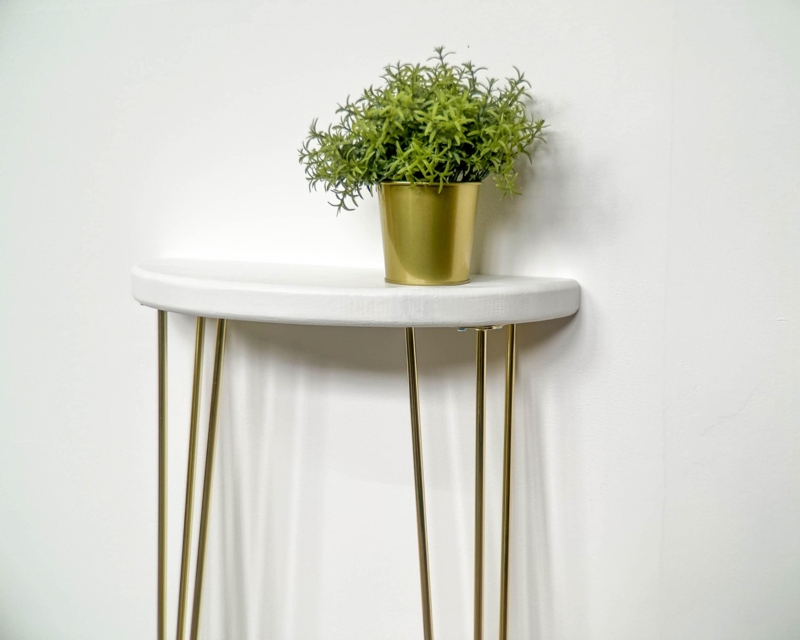 Modern Glam Console Table with Slender Gold Legs and White Top