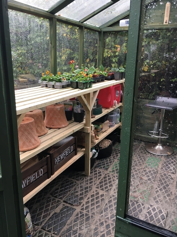 Natural Wood Potting Bench featuring Diagonal Braces and Slatted Shelves