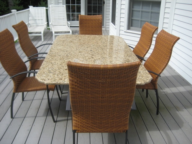 Patio Dining Set: Granite Top Table, Honey Brown Woven High Back Chairs.