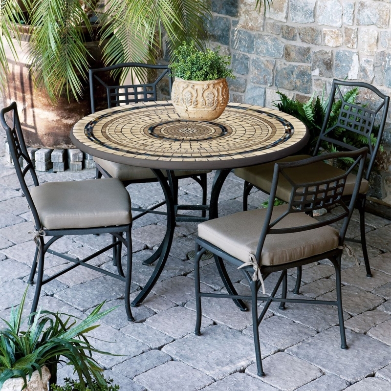 Patio Dining Set: Round Mosaic Top, Curved Legs, Lattice Back Chairs.
