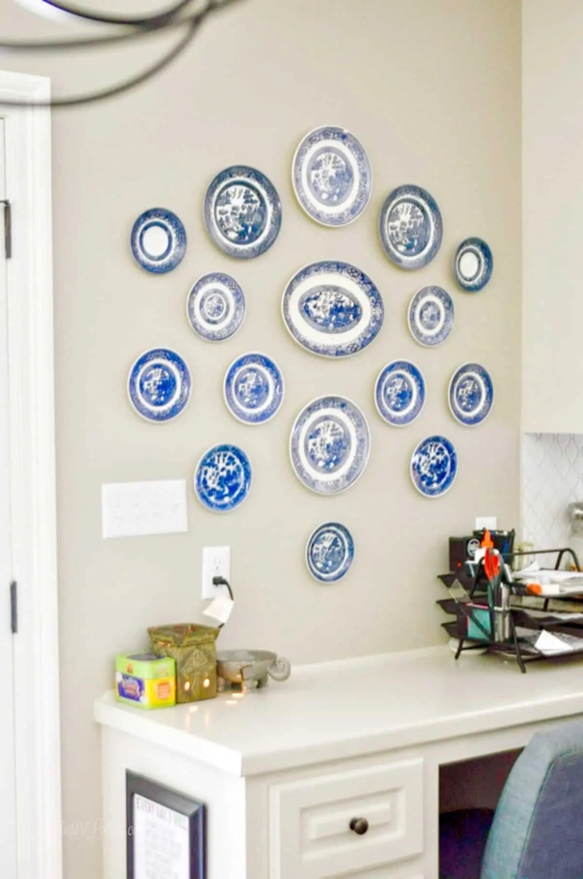 Plate Wall Display with Blue Willow Pattern above Built-In Desk