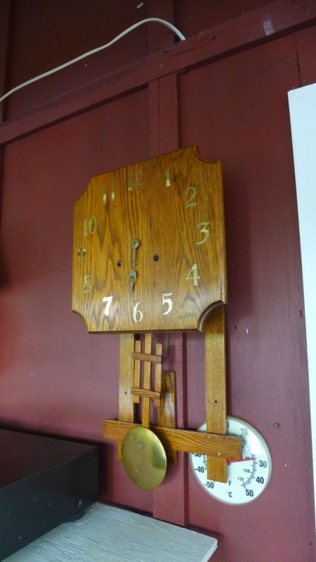 Rustic Wooden Wall Clock with Slats and Exposed Mechanism