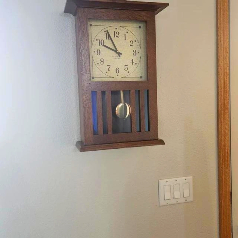 Slatted Wood Wall Clock with Brass Pendulum Window