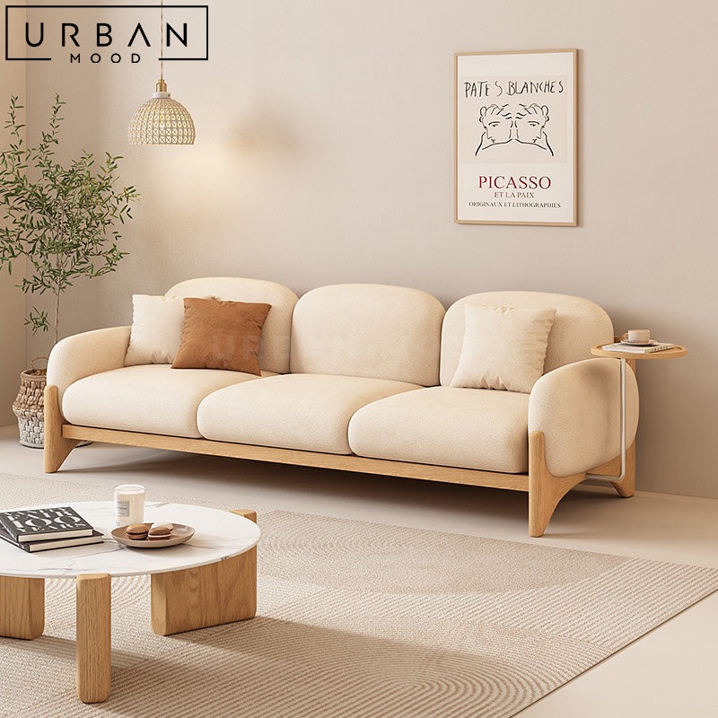 Sofa featuring Organic Pebble Shaped Cushions and Boucle Texture