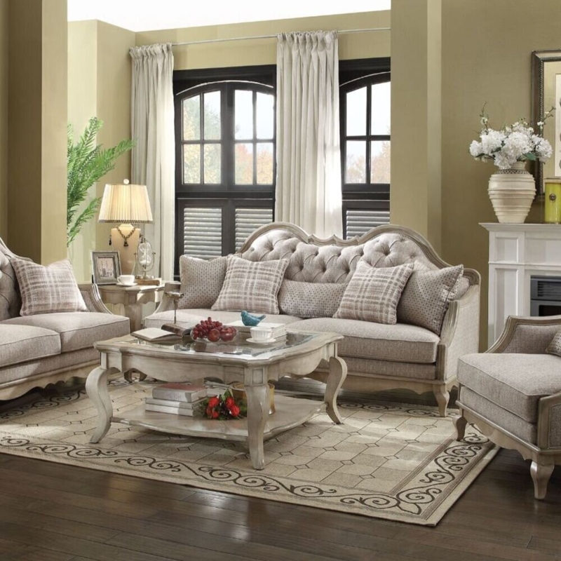 Sofa: Tufted Camelback Couch and Provincial Glass Coffee Table