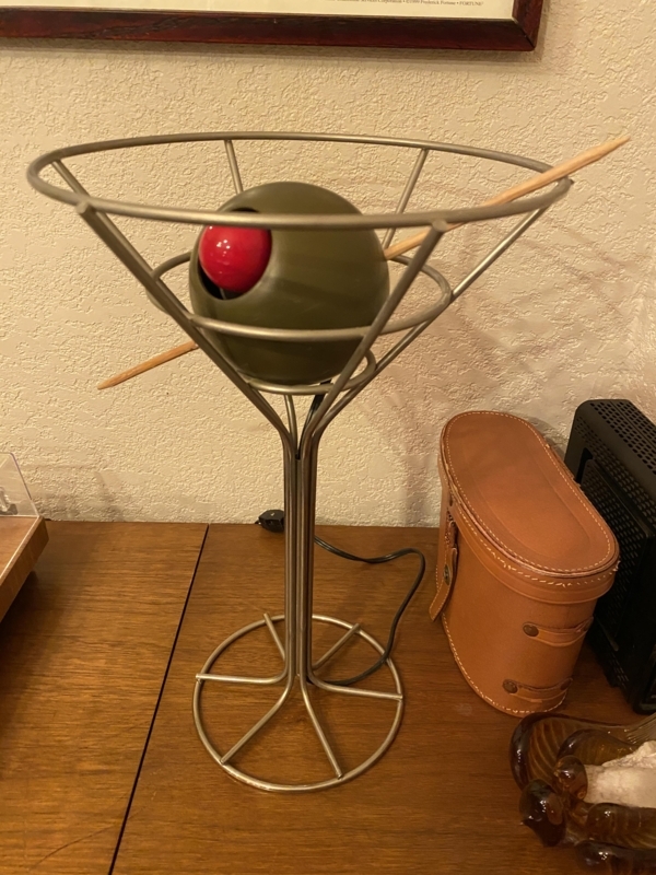 Table Lamp: Brushed Metal Wireframe Martini Glass with Oversized Olive.