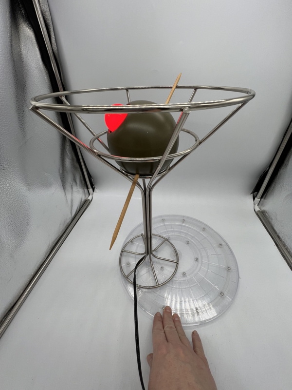 Table Lamp: Polished Metal Wireframe with Illuminated Pimento Olive.