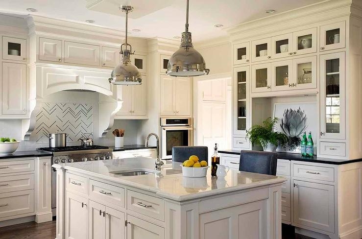 Transitional Ivory Shaker Cabinets with Chevron Tile Backsplash