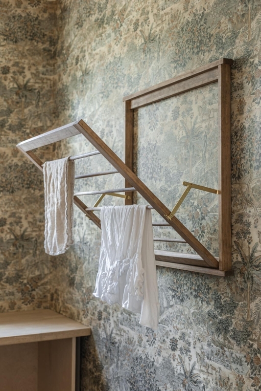 Wall Mounted Drying Rack: Wood Folding Frame with Brass Support Arms.