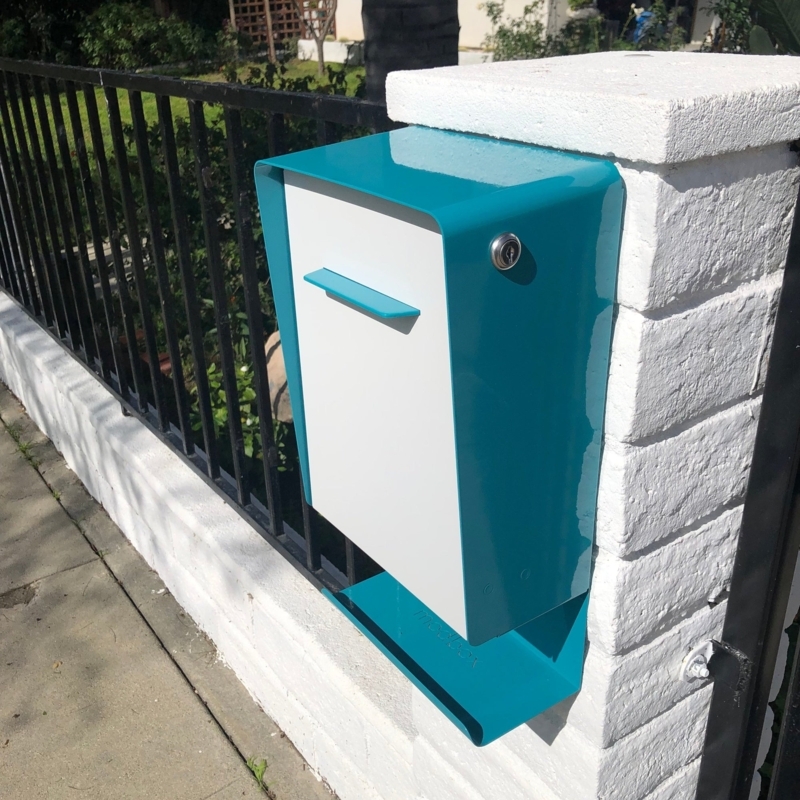 Wall Mounted Mailbox: Teal Blue Curved Design with Newspaper Cradle.
