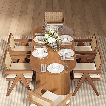 Warm Wood Oval Dining Table with Solid Pedestal and Cane Back Chairs