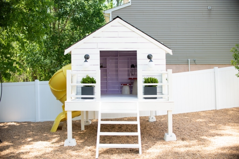 White Elevated Playhouse with Lavender Interior & Globe Sconces
