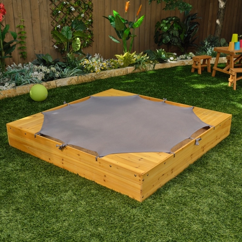 Wooden Sandbox featuring a Wide Seating Ledge and Fabric Cover Ties