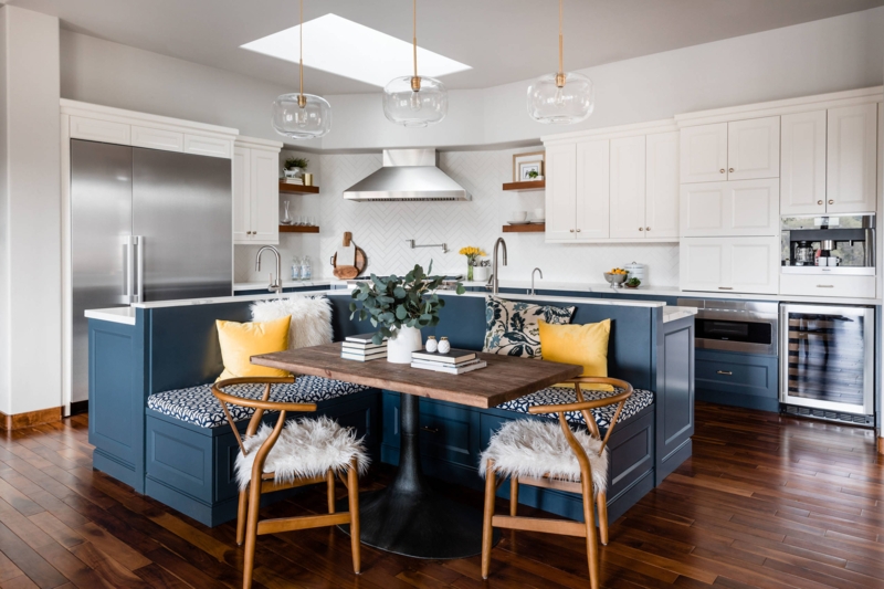 Banquette Seating with Wishbone Back Chairs and Herringbone Tile.