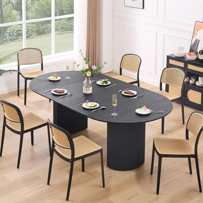 Black Oval Extendable Table with Fluted Pedestal and Cane Back Chairs