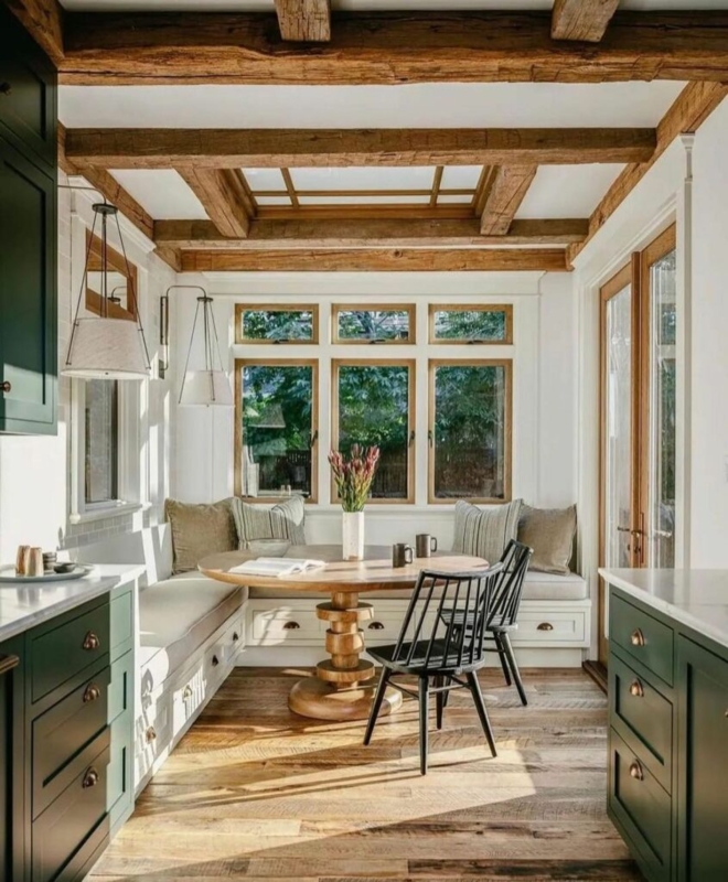 Breakfast Nook with Forest Green Cabinetry and Exposed Beams.