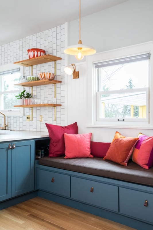 Built In Banquette highlights Teal Cabinetry and Leather Pulls.