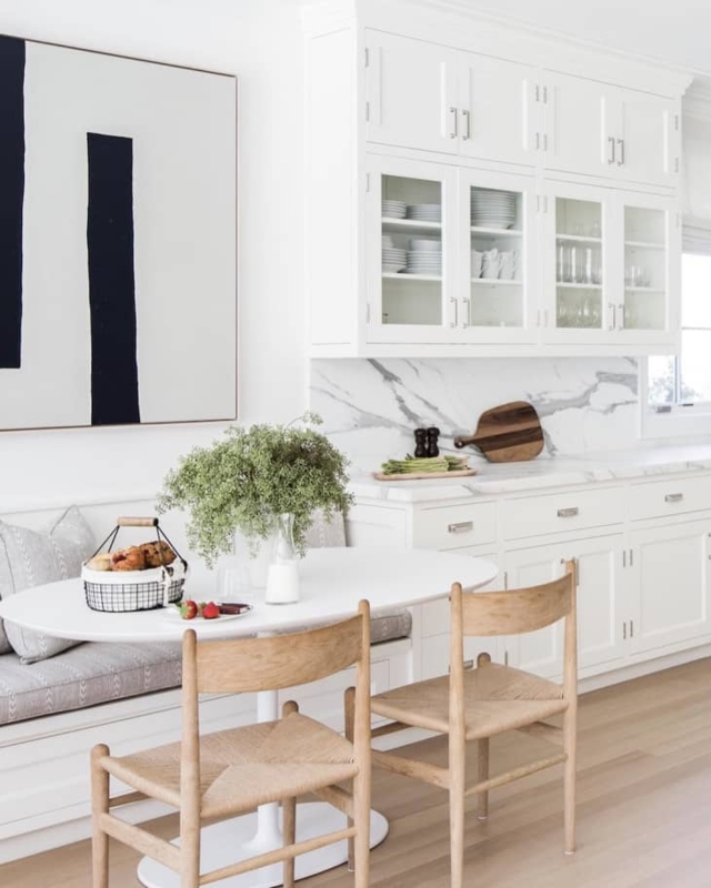 Built In Banquette with Woven Seats and Marble Backsplash Design.