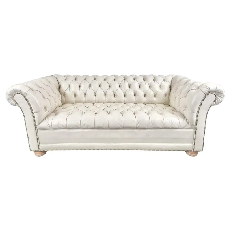 Chesterfield Sofa: Ivory Leather Chesterfield with Bun Feet and Trim