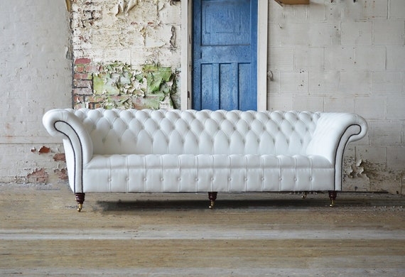 Chesterfield Sofa: Large 4 Seater with Brass Casters and Scrolled Arms