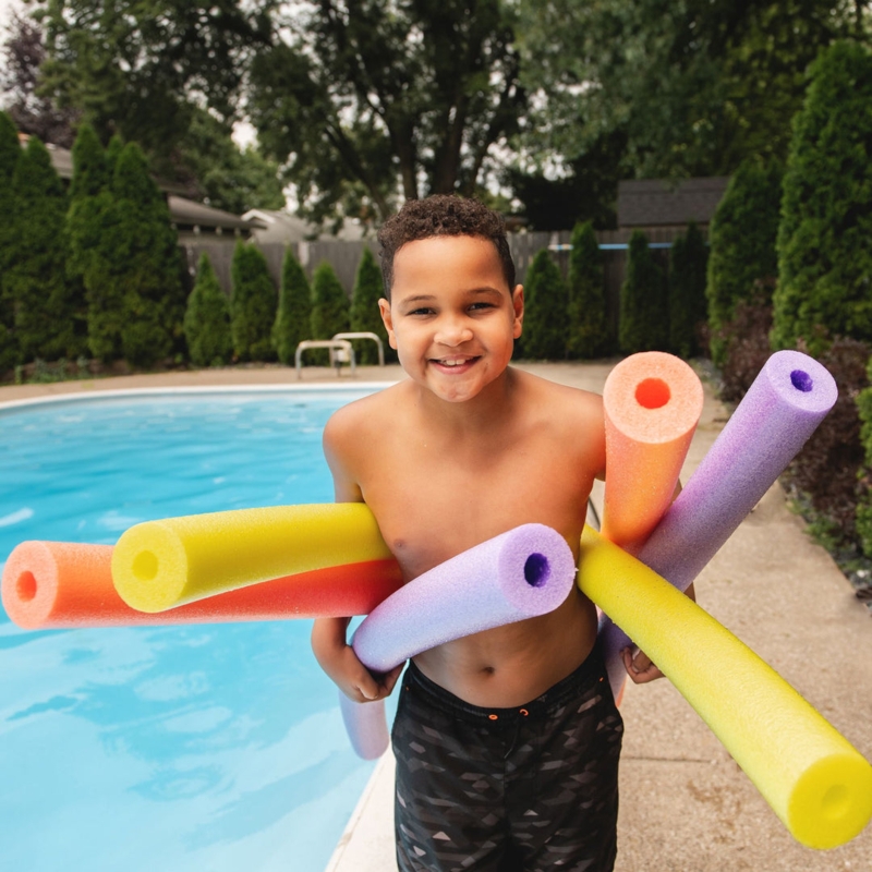 Colorful Foam Pool Noodles Hollow Center Vibrant Colors Porous Texture.