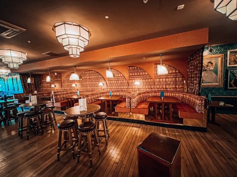 Commercial Pub Interior: Curved Banquettes, Tiered Pendants. Art Deco Style.