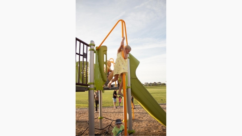Contemporary Playground Firepole with Safety Orange Vibe Handholds