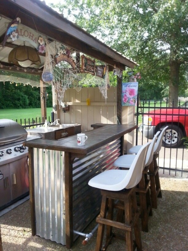 Corrugated Metal Outdoor Bar with White Bucket Stools