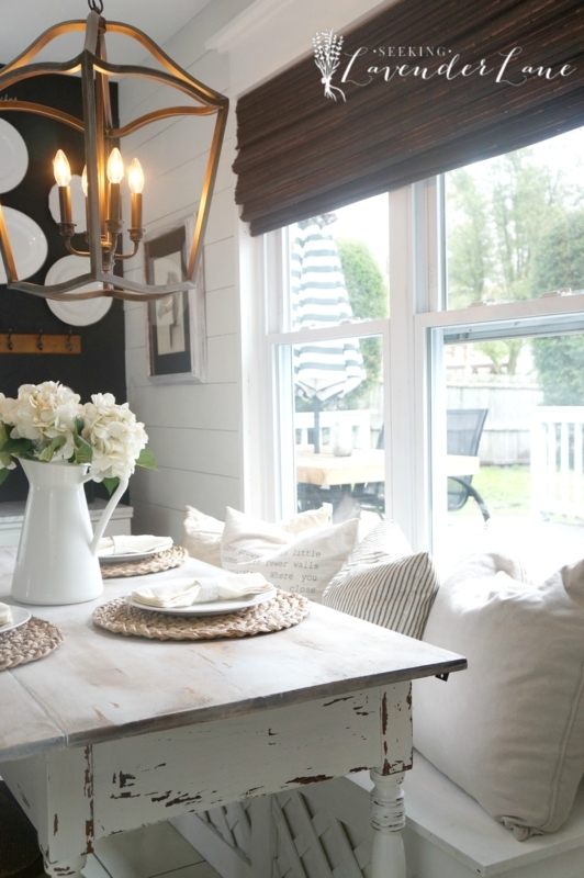 Cottage Dining Table: Turned Legs, Window Seat Context, Lantern Pendant.